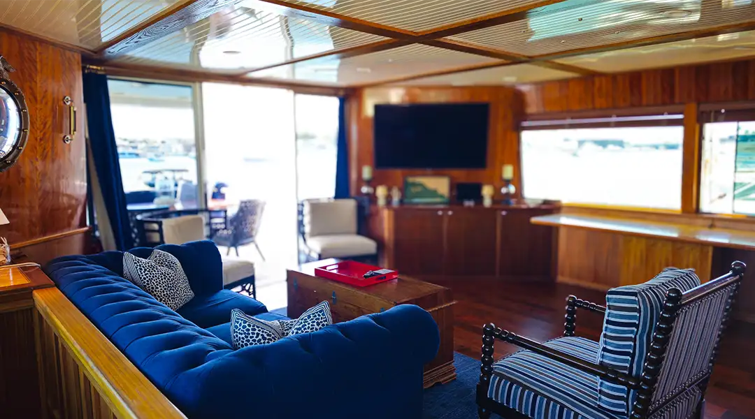 Remodeled interior lounge with television and blue couch