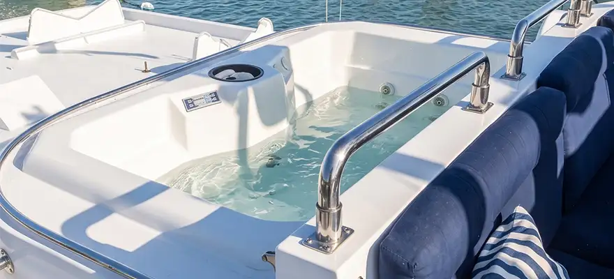 Upper deck jacuzzi with water and surrounding lounge seating