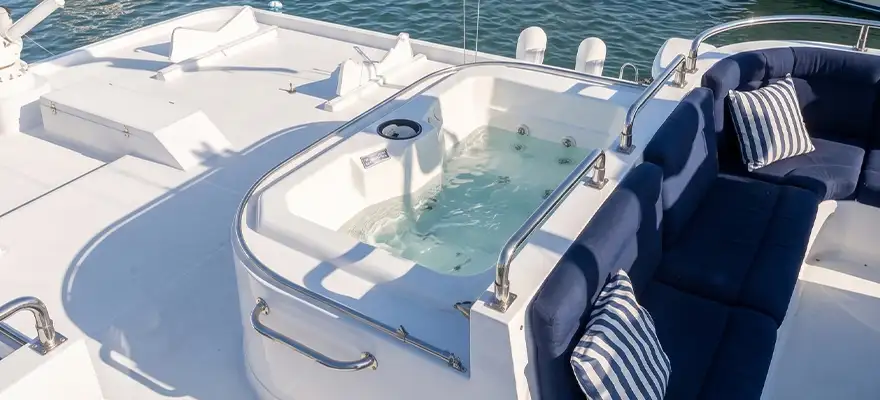 Upper deck jacuzzi and blue lounge cushions