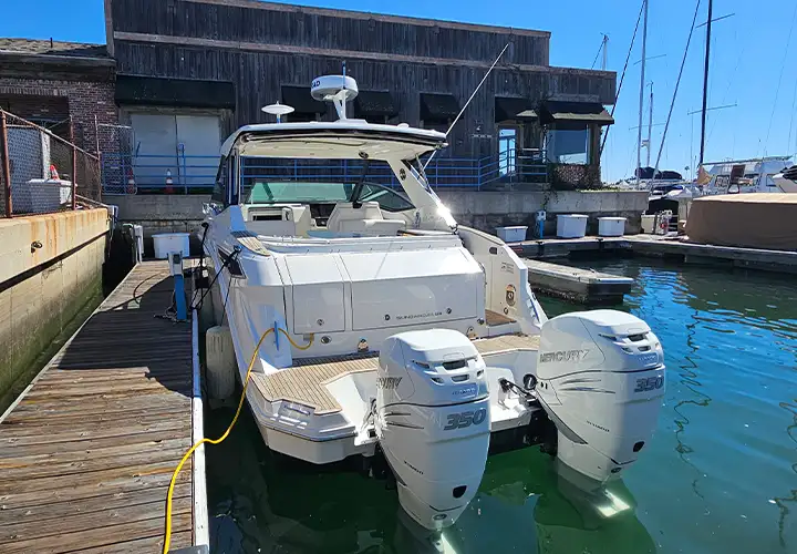 Sea Ray aft seating, stern platforms and twin outboard engines at the dock
