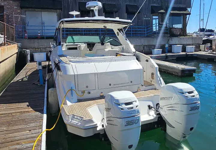 Rear view of the Sea Ray and its two white Mercury outboards